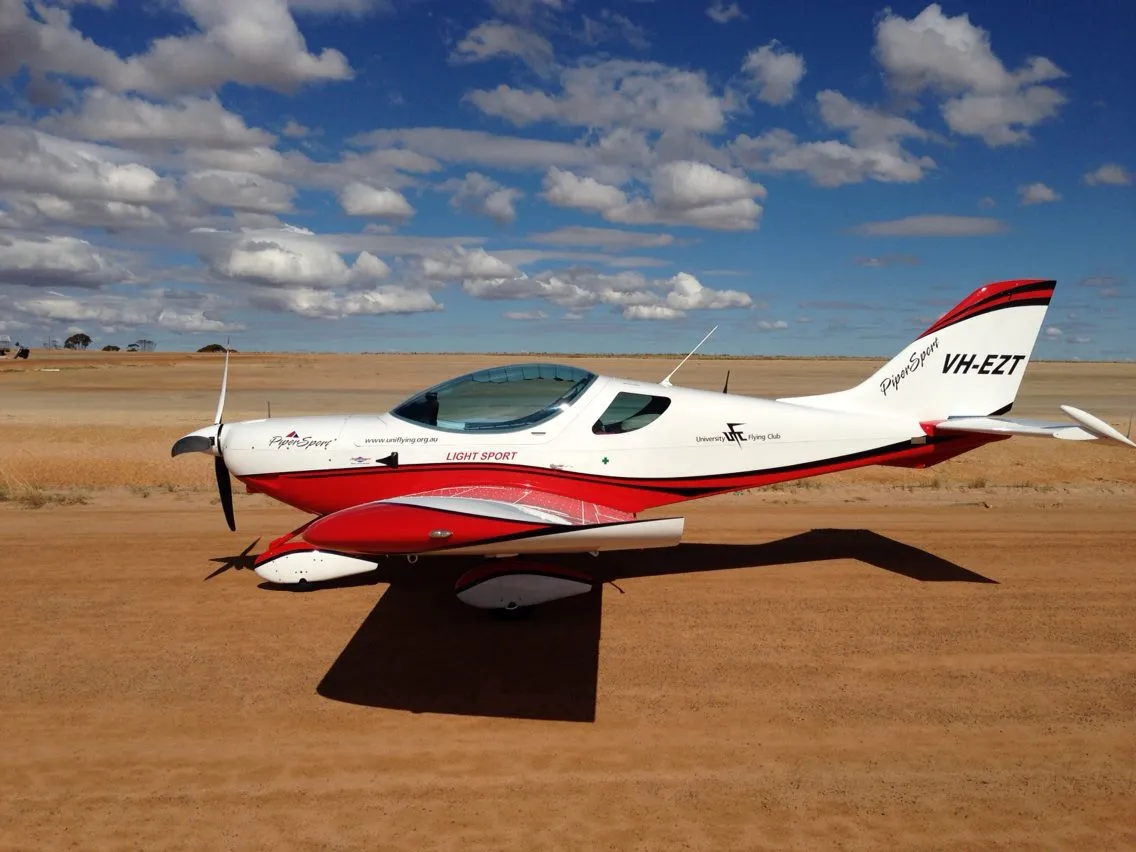 VH-EZT parked on the red dirt airstrip at Wyalkatchem