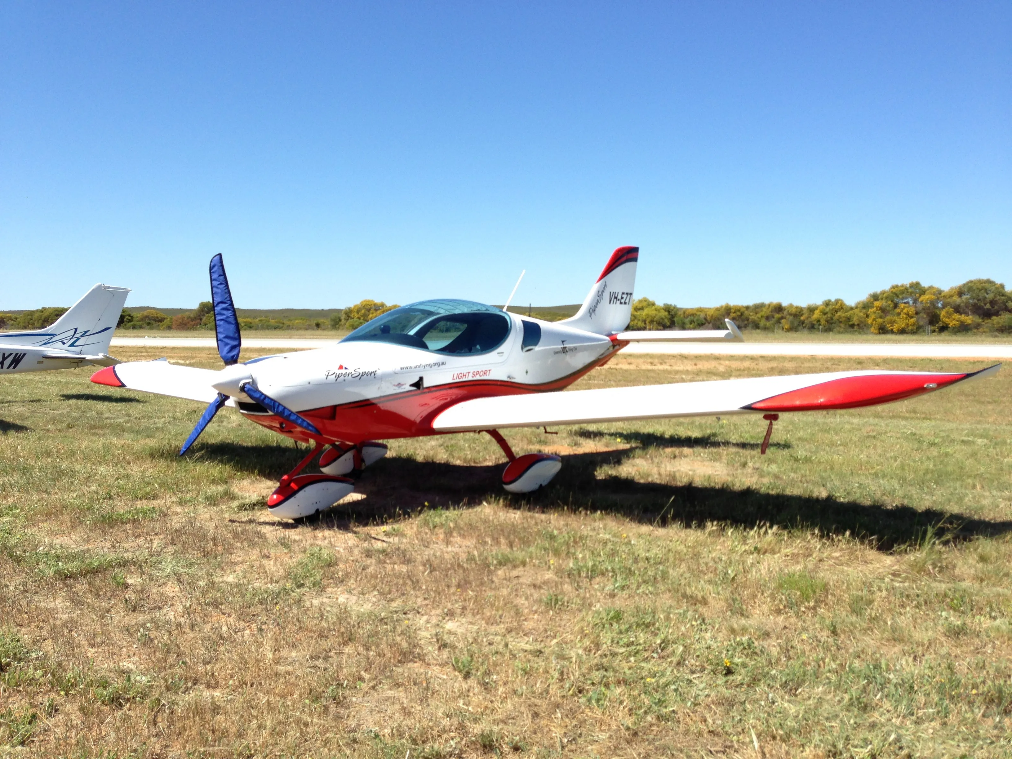 VH-EZT parked on the grass at Jurien Bay