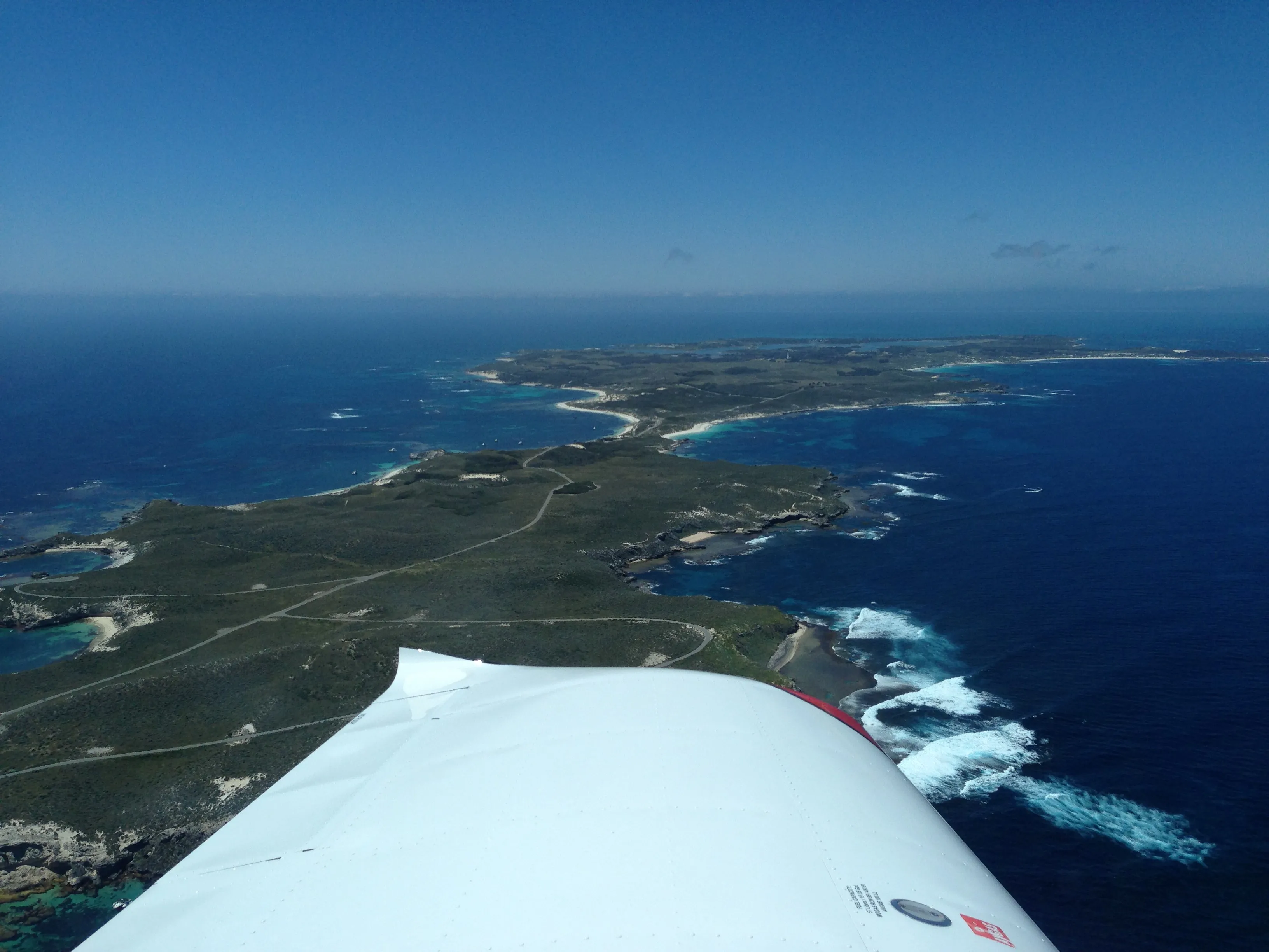 Rottnest Island's western end and the surrounding ocean seen from VH-EZT