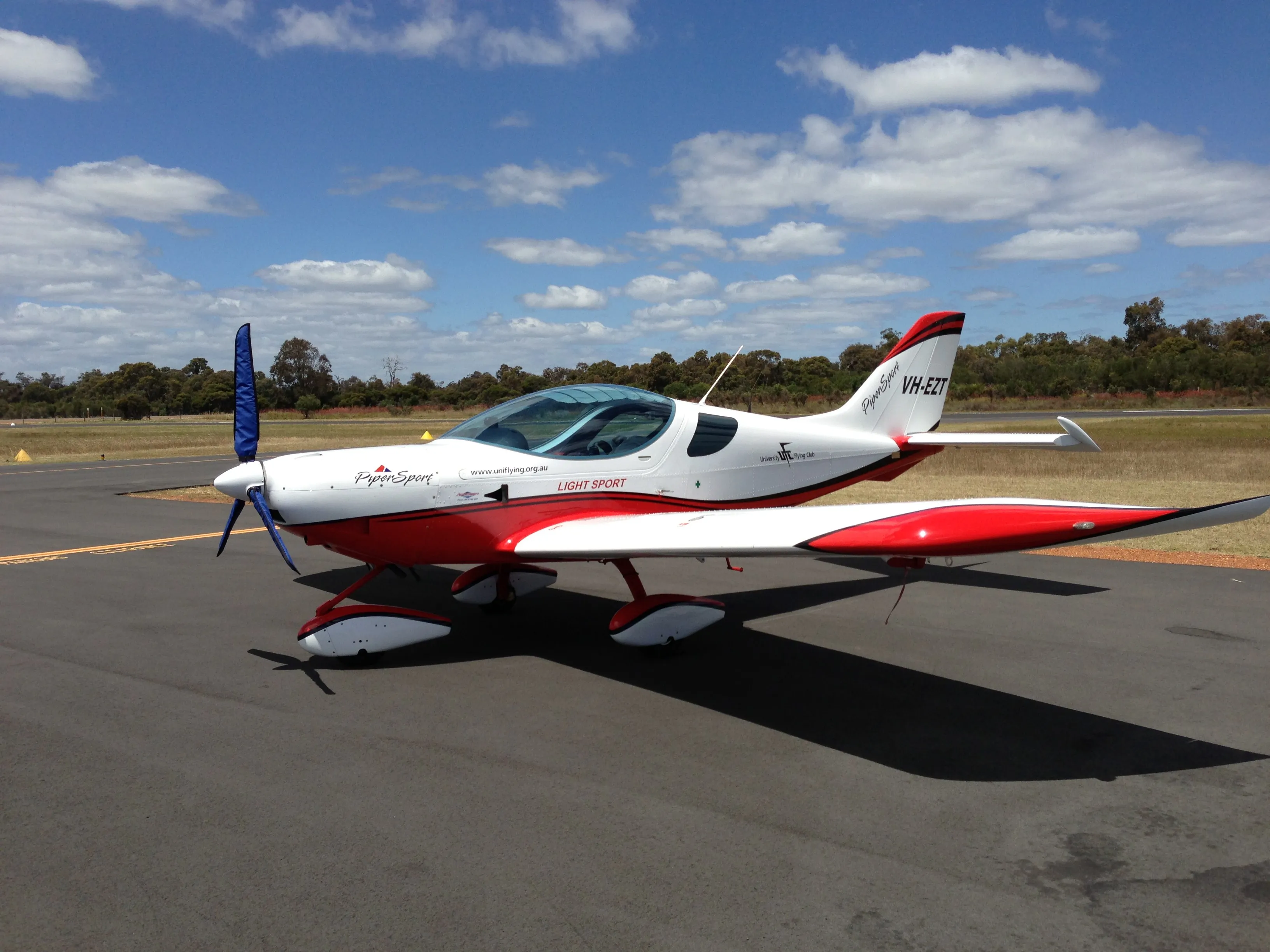 VH-EZT parked at Bunbury Airport with its propeller cover fitted