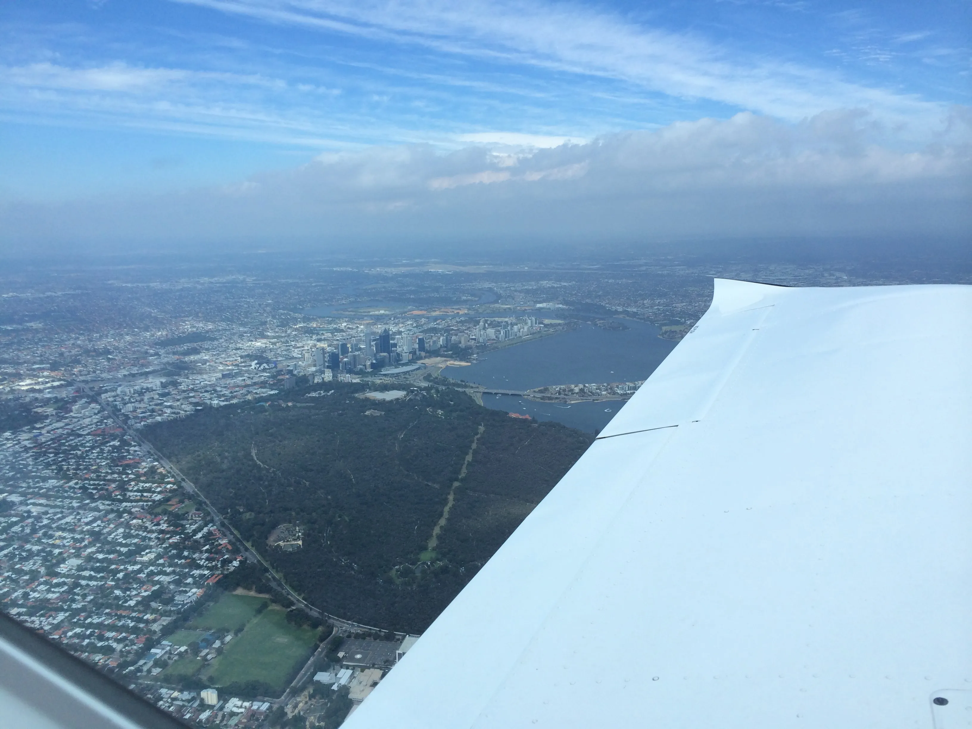 Perth city and Kings Park seen over VH-EZT's wing