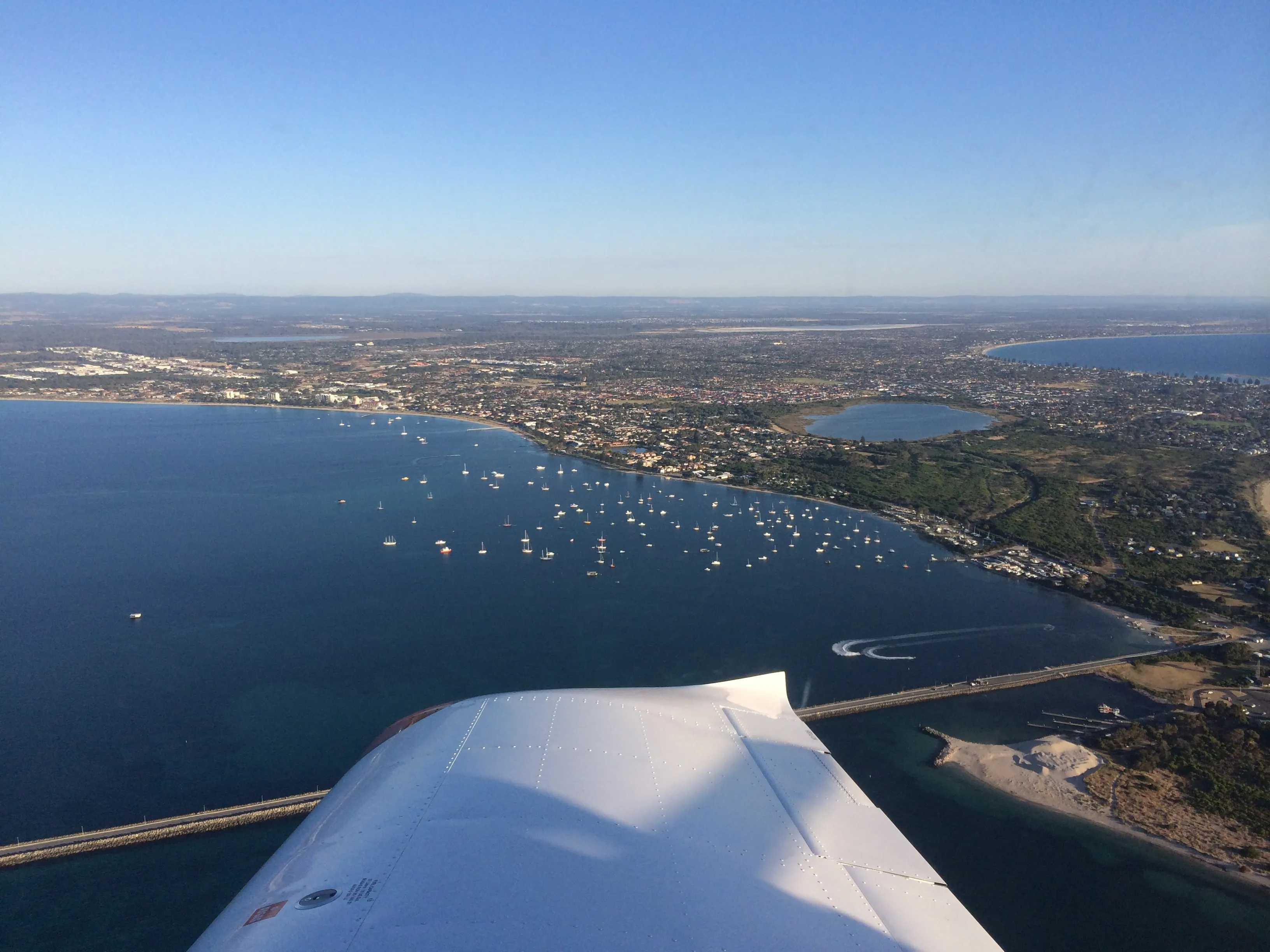 Boats moored in Mangles Bay at Rockingham, seen from VH-EZT