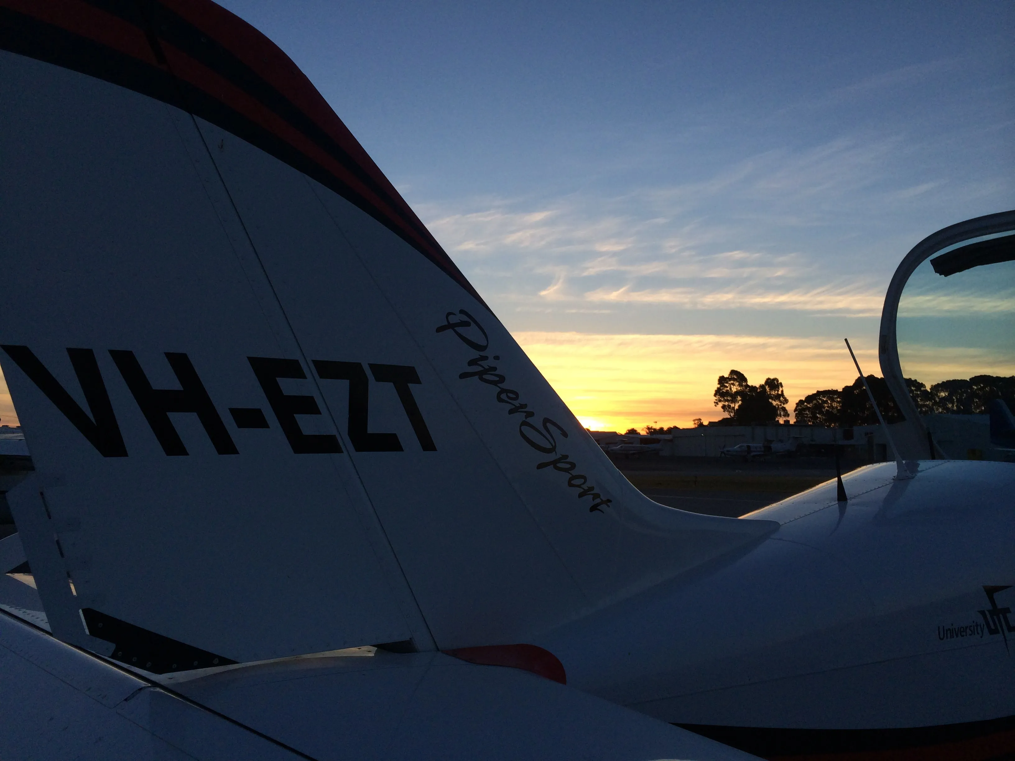 Close-up of VH-EZT's tail fin at sunset