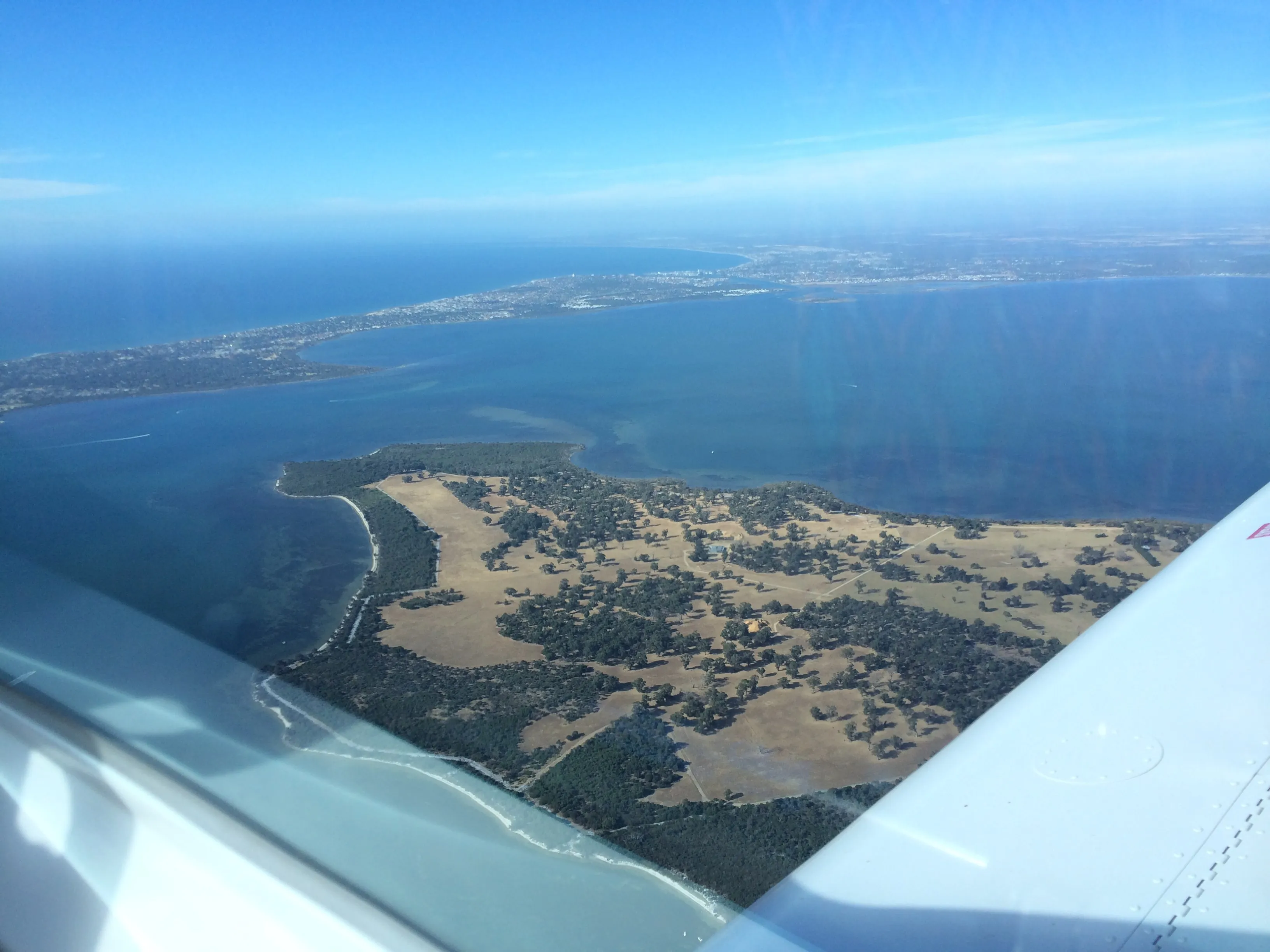 Aerial view over an estuary on the coast south of Perth from VH-EZT